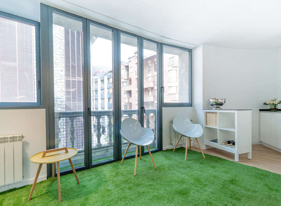 Discover a unique urban oasis in this stylish property, featuring a vibrant green turf floor that adds a touch of nature indoors.