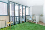 Discover a unique urban oasis in this stylish property, featuring a vibrant green turf floor that adds a touch of nature indoors.