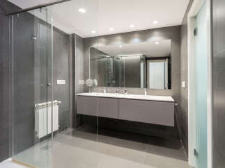 Step into a modern bathroom oasis, featuring sleek design and luxurious finishes.
