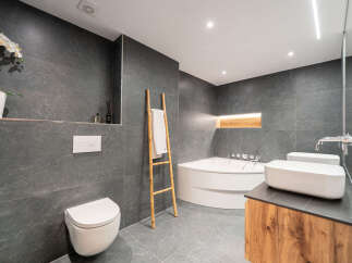 Step into luxury with this stunning bathroom featuring sleek, modern design.