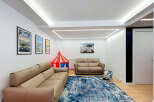 This spacious living room features a large, comfortable sectional sofa perfect for family gatherings.