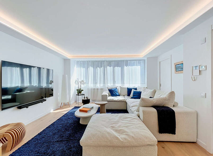 Experience modern living in this beautifully appointed living room, featuring a spacious sectional sofa perfect for relaxation and entertaining.