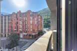 Experience urban living with a mountain backdrop from this charming apartment.