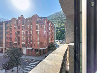 Experience urban living with a mountain backdrop from this charming apartment.