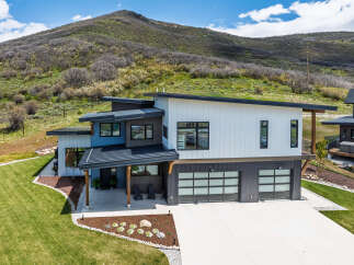 This stunning modern home offers a perfect blend of contemporary design and natural beauty.