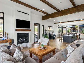 This stunning living space boasts a modern fireplace, perfect for cozy evenings.