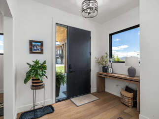 Step into this stunning entryway, showcasing a modern design with sleek lines and natural light.
