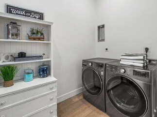 Step into the epitome of modern convenience with this stunning laundry room.