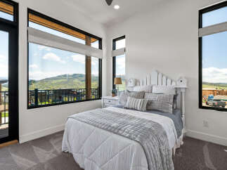 This stunning bedroom boasts breathtaking views and modern design.