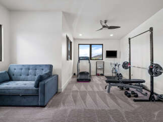 This modern home gym offers a versatile space for fitness enthusiasts.