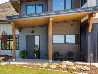 This stunning modern home boasts a sleek design with a welcoming entrance.