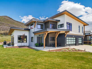 This stunning modern home offers a perfect blend of luxury and natural beauty.