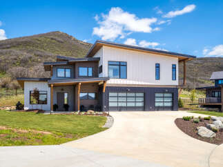 This stunning modern home offers a luxurious living experience with its sleek design and high-end finishes.