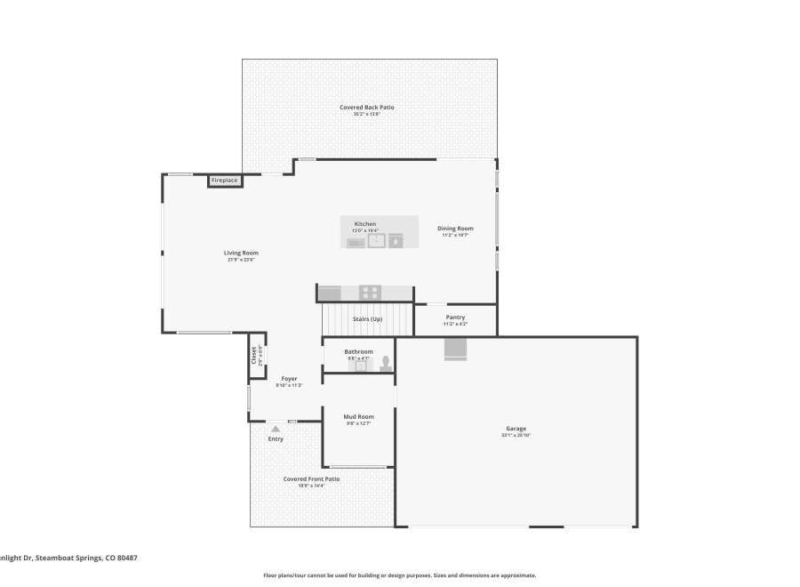 Discover this spacious Steamboat Springs home featuring a large living room with a fireplace, perfect for cozy evenings.