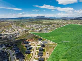 Discover this prime real estate opportunity featuring 57 acres of open space with stunning mountain views, including the iconic Sleeping Giant.