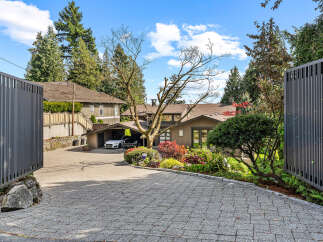 Discover luxury living in this stunning property featuring a beautifully landscaped entrance and a private driveway.