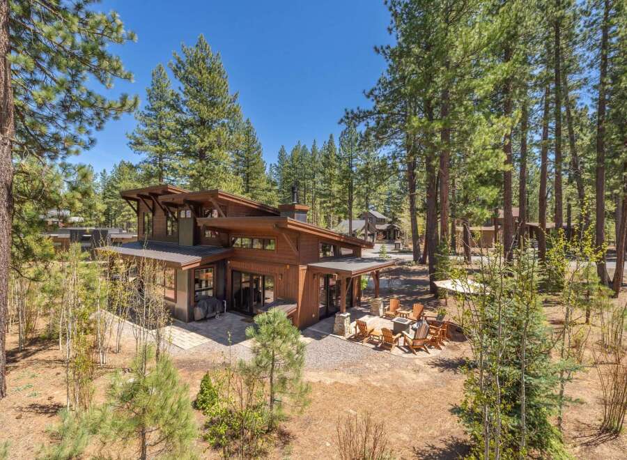 Discover the epitome of modern luxury in this stunning wooden house nestled amidst a serene forest setting.