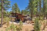 Discover the epitome of modern luxury in this stunning wooden house nestled amidst a serene forest setting.