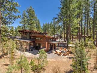 Discover the epitome of modern luxury in this stunning wooden house nestled amidst a serene forest setting.