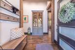 Step into luxury with this stunning entryway! Featuring a beautiful wooden bench, a stylish coat rack, and a charming cabinet, this space is both functional and inviting.