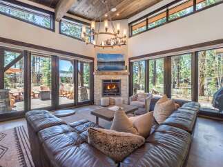 Experience luxury living in this stunning property featuring a cozy fireplace, perfect for chilly evenings.