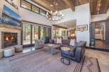 Experience luxury living in this stunning property, featuring a cozy fireplace and a spacious living area.