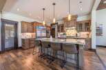 Step into luxury with this stunning kitchen! Featuring custom cabinetry, a spacious island with seating, and high-end appliances, this space is perfect for both cooking and entertaining.