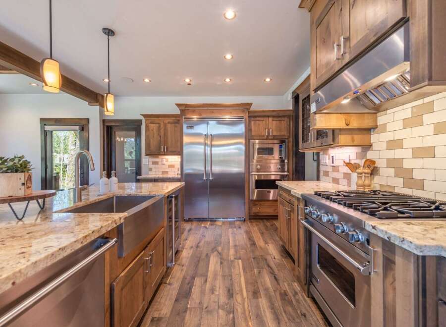 This stunning kitchen boasts high-end appliances, including a Viking range and refrigerator, perfect for the culinary enthusiast.