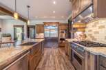 This stunning kitchen boasts high-end appliances, including a Viking range and refrigerator, perfect for the culinary enthusiast.