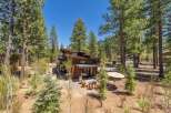Nestled amidst towering pines, this stunning modern home offers a serene escape.