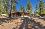This stunning property boasts a modern architectural design with a warm, inviting aesthetic.