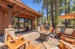 Enjoy the ultimate outdoor living experience with this stunning property! Featuring a cozy fire pit, comfortable Adirondack chairs, and a beautiful patio, this space is perfect for entertaining or relaxing.