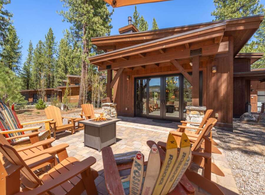 Experience luxury living in this stunning property, featuring a cozy outdoor patio with a fire pit, perfect for entertaining.