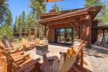 Experience luxury living in this stunning property, featuring a cozy outdoor patio with a fire pit, perfect for entertaining.