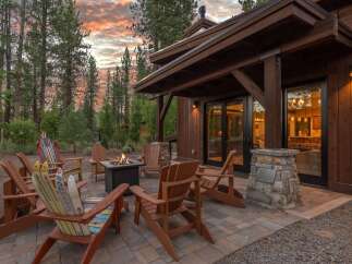 Experience the perfect blend of rustic charm and modern comfort with this inviting outdoor living space.