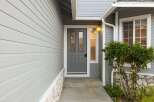 Welcome home to this charming property! Featuring a stylish gray front door and siding, this home offers great curb appeal.