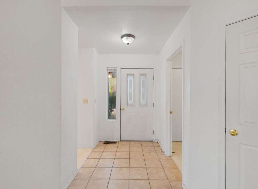 Step into this inviting entryway, featuring a bright and airy atmosphere.