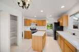 This spacious kitchen features ample cabinet space, perfect for storage and organization.
