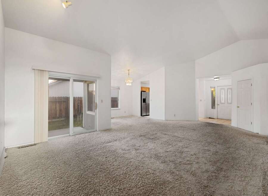 Step into this spacious home featuring a bright and airy living area with a neutral color palette.