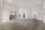 Step into this spacious home featuring a bright and airy living area with a neutral color palette.