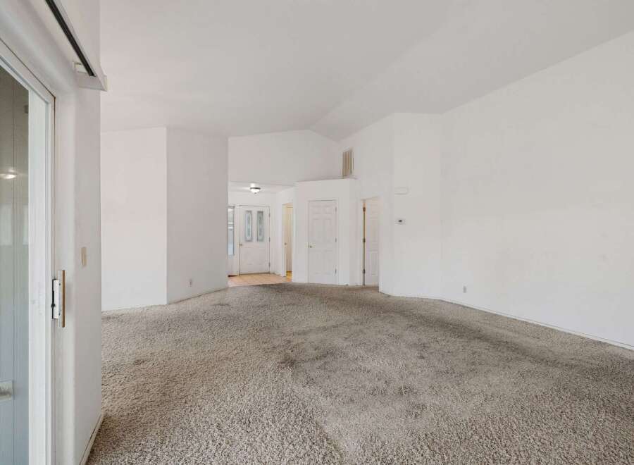 Step into this inviting living space, featuring a neutral color palette and ample natural light.
