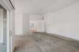 Step into this inviting living space, featuring a neutral color palette and ample natural light.