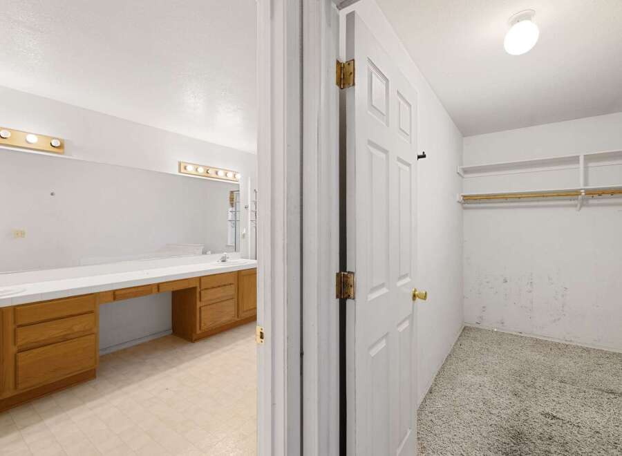 Step into this inviting home and discover a well-designed bathroom and a convenient walk-in closet.