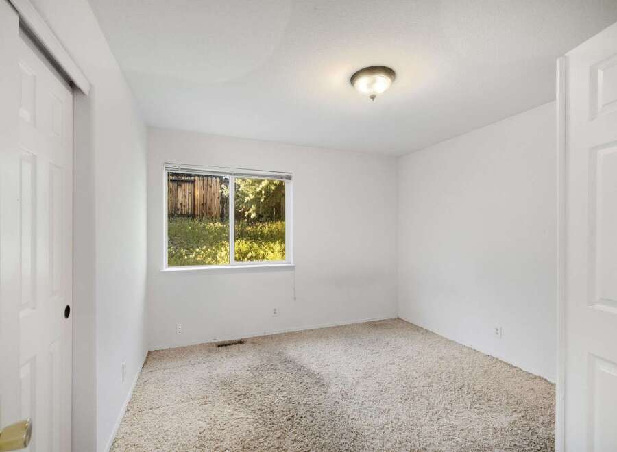 This bright and airy room features a neutral color palette, perfect for any decor style.