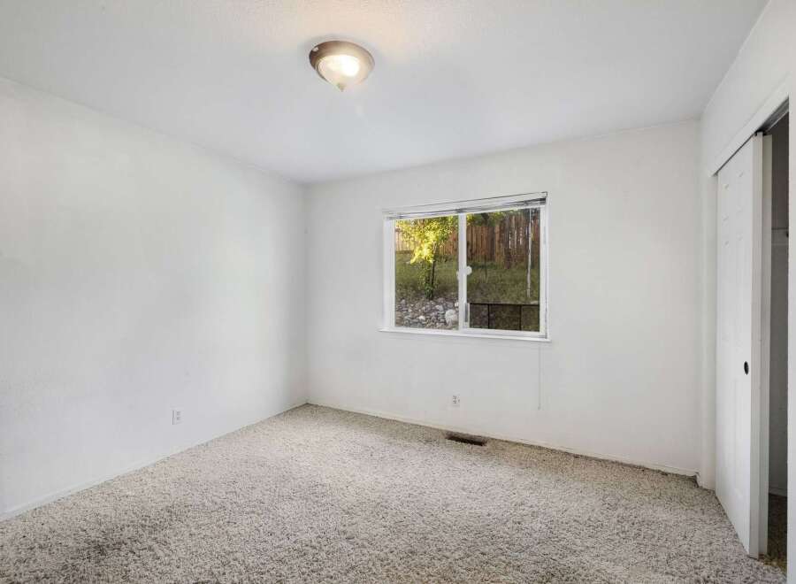 Discover the potential of this inviting space! This room features a bright window that offers natural light and a view.