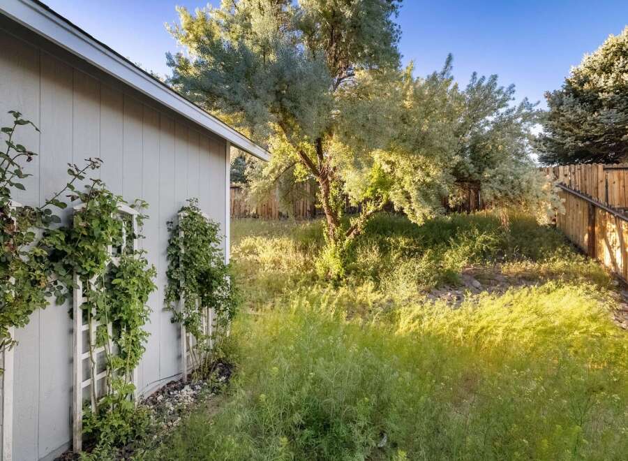Discover the charm of this property, featuring a beautifully landscaped yard and a serene outdoor space.
