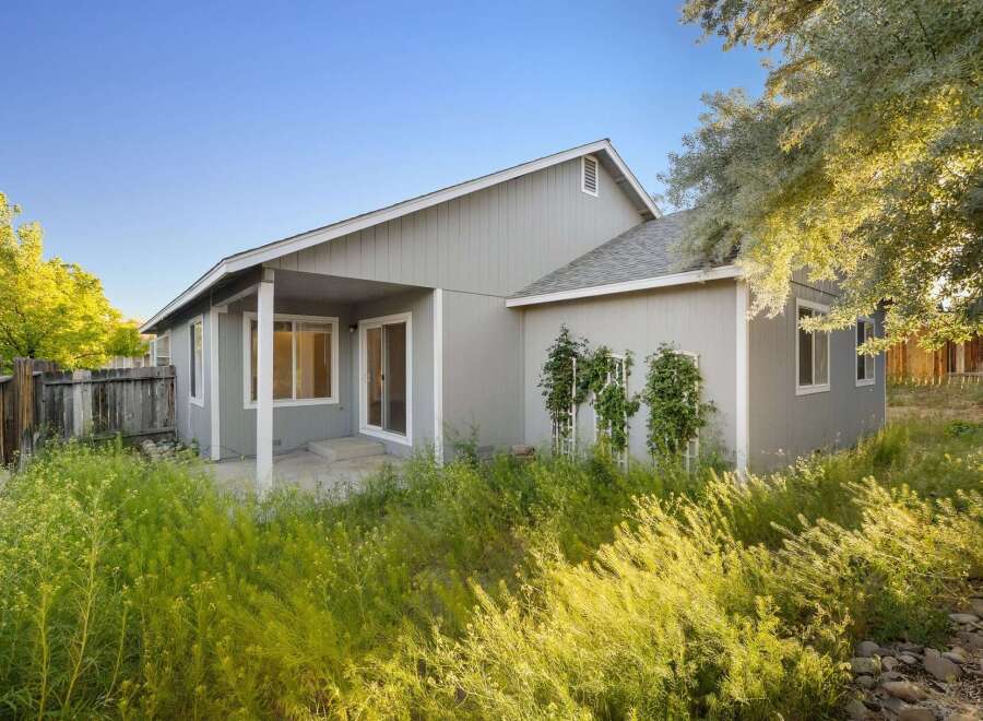 Discover this charming property featuring a well-maintained exterior and inviting outdoor space.