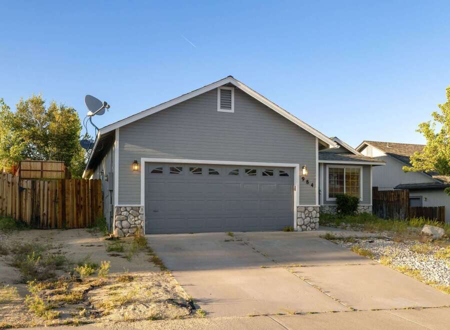 Discover this charming property featuring a spacious garage and a well-maintained exterior.