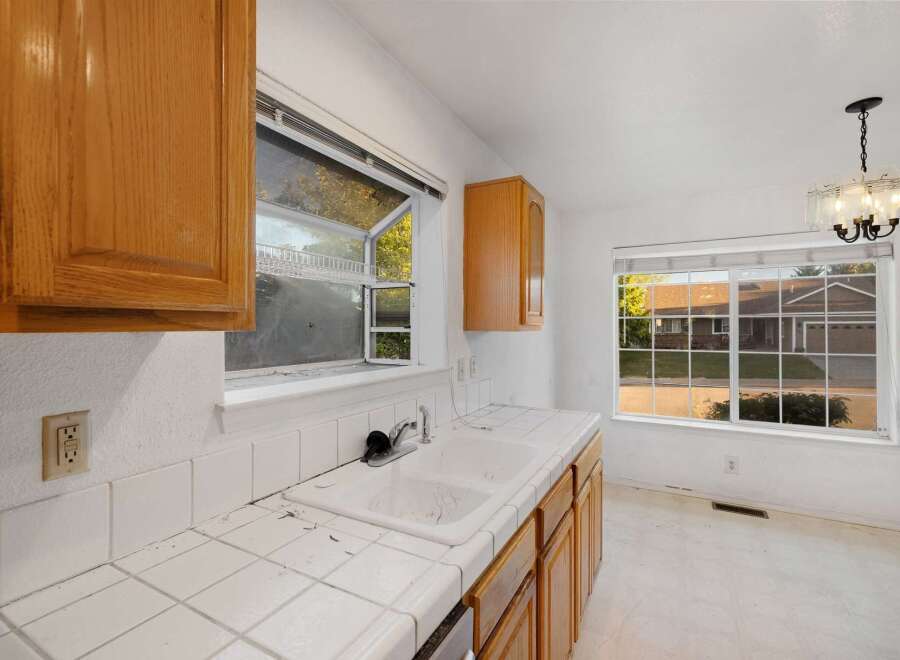 This kitchen features classic wooden cabinetry and a bright, airy feel.