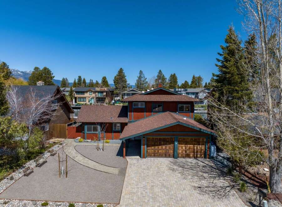 This stunning property boasts a beautiful exterior with a spacious driveway and a charming garage.